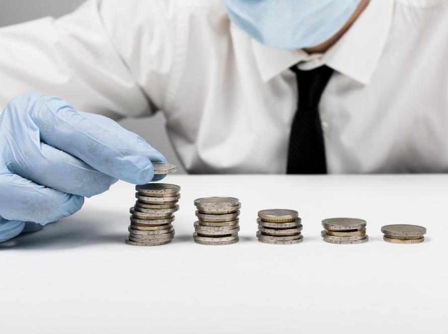 piles-coins-man-wearing-protection-gloves